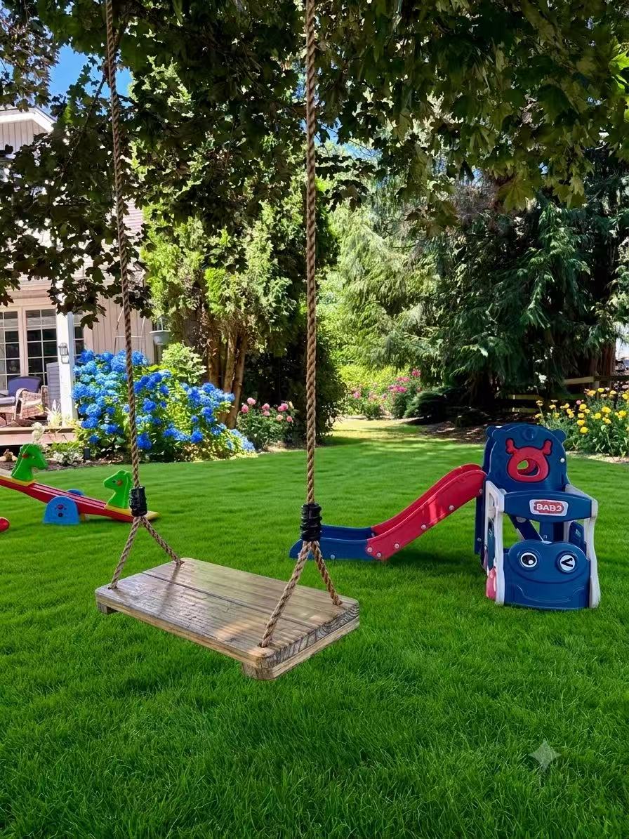 A wooden swing under a leafy tree in the garden